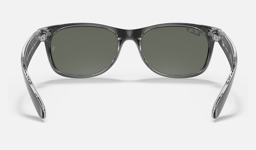 Matte black wayfarer sunglasses with dark green polarized lenses, front view close
