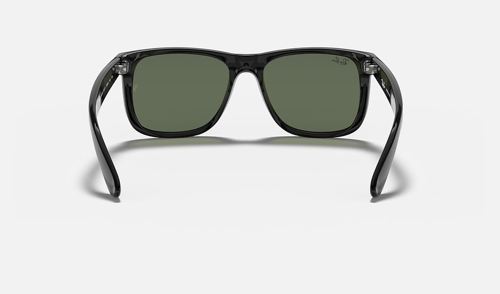 Ray-Ban black sunglasses with dark green lenses, straight-on front view.