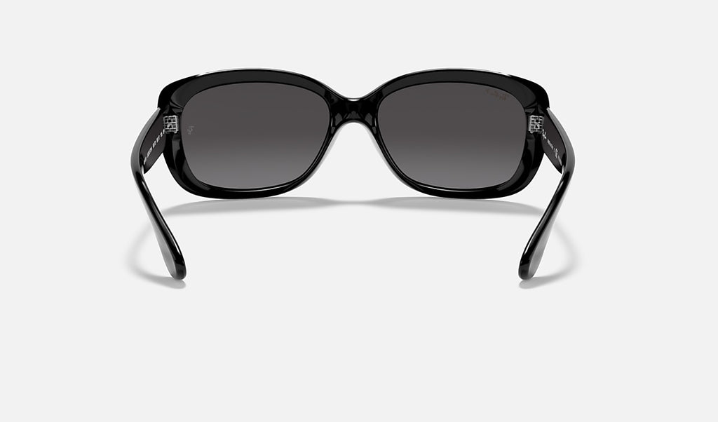 Polished black sunglasses front view with rounded lenses and low profile arms