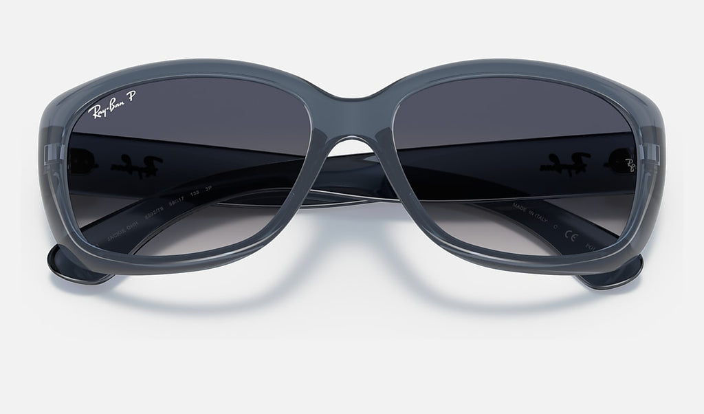 Polarised sunglasses close view, transparent blue frame with dark gradient lenses