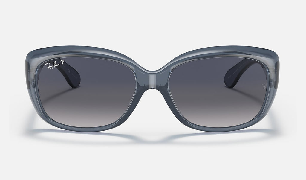 Polarised sunglasses with transparent blue frame and smoke-dark lenses and curved bridge