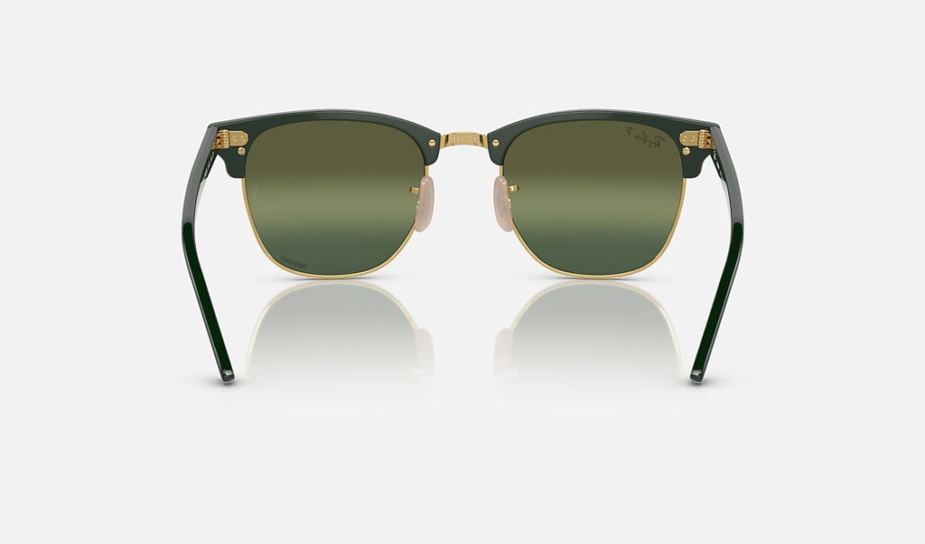 Polished green on gold sunglasses with dark green mirrored polarized lenses, straight-on view