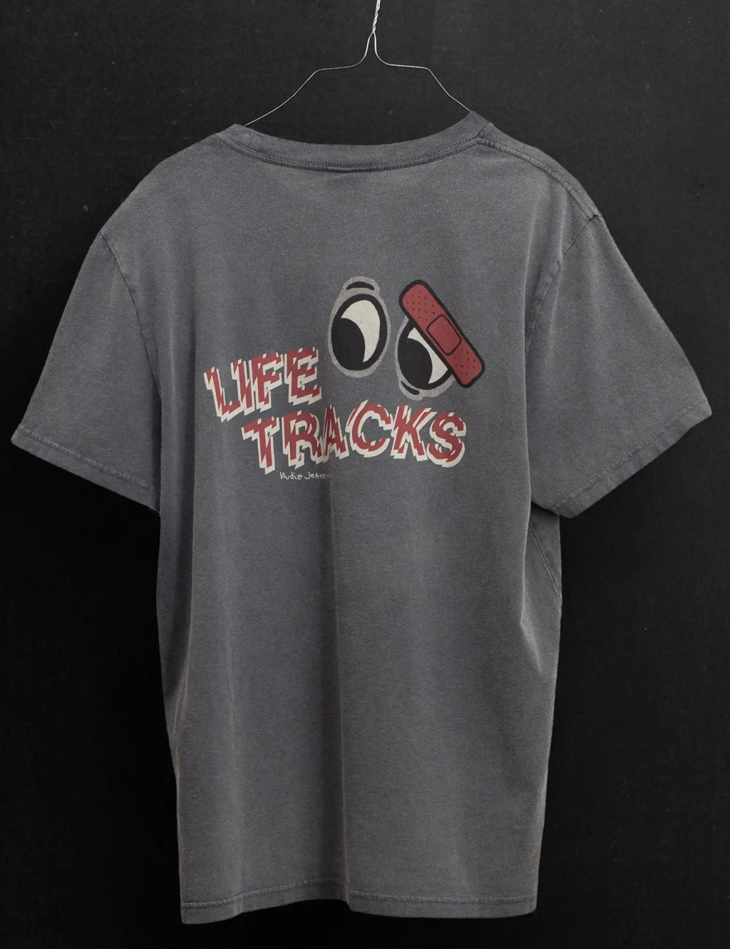 Anthracite T-shirt hanging with Life Tracks graphic on the back