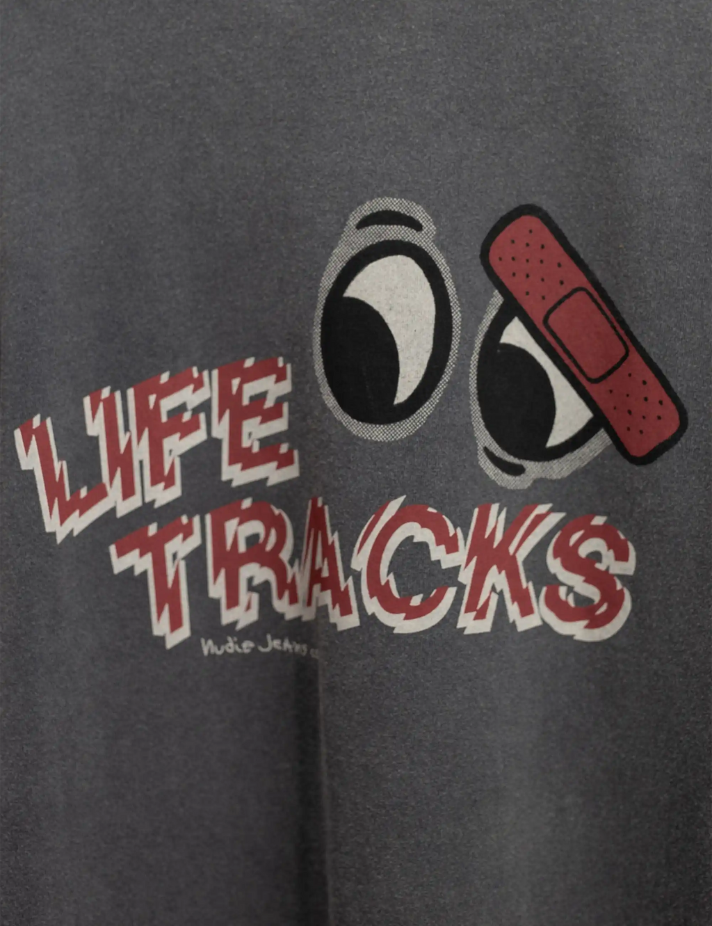 Anthracite T-shirt close-up of Life Tracks text and speakers graphic