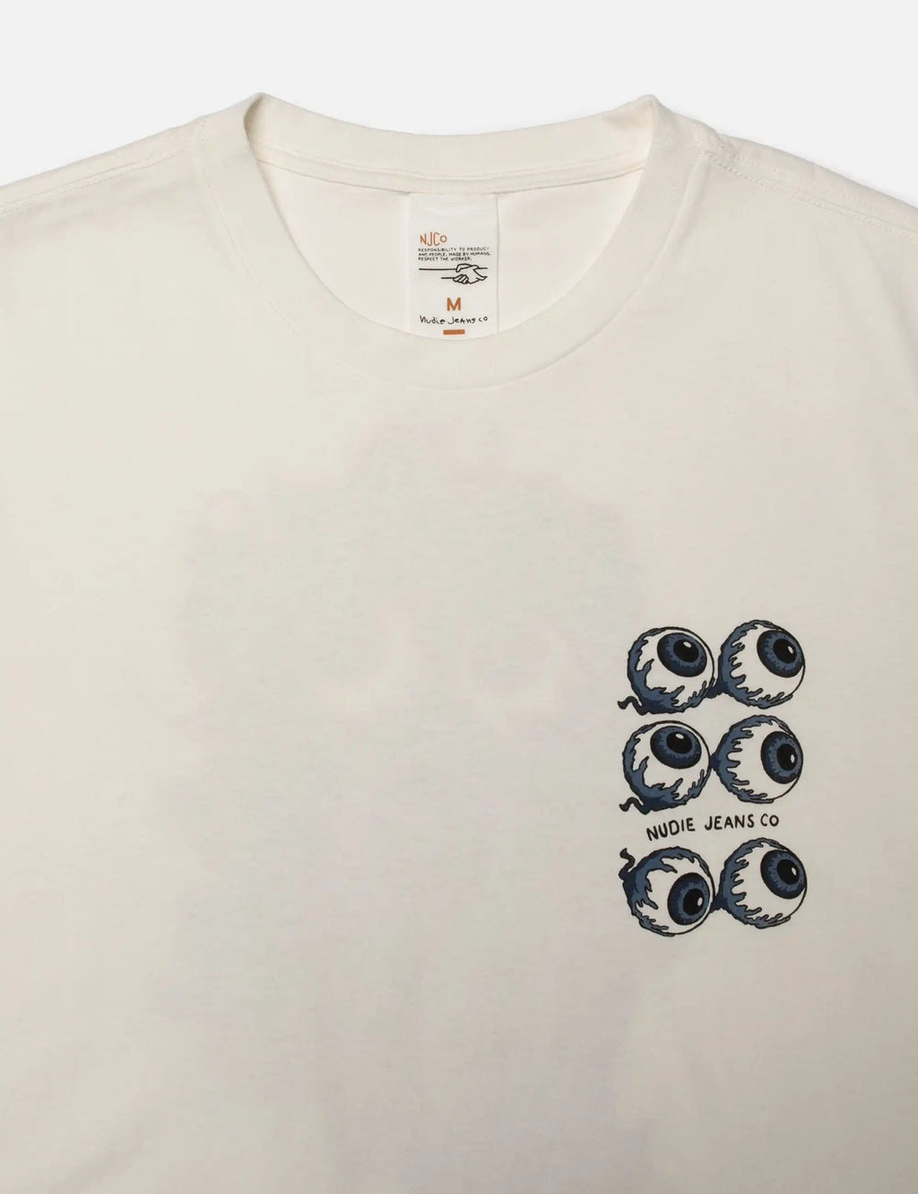Chalk white T-shirt with crew neck and small blue eye graphic on chest