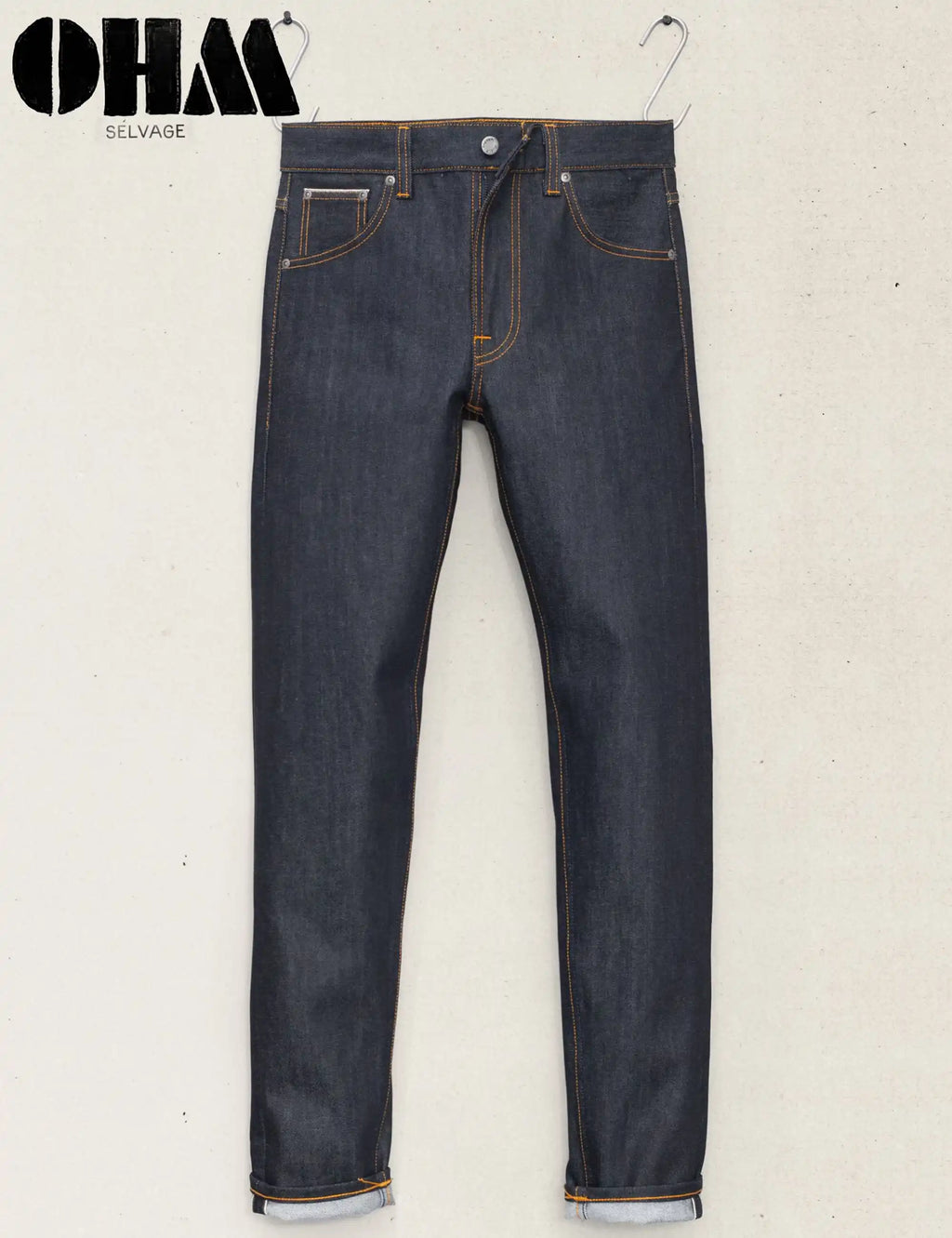 Men's blue selvage jeans on hangers, straight leg, contrast orange stitching