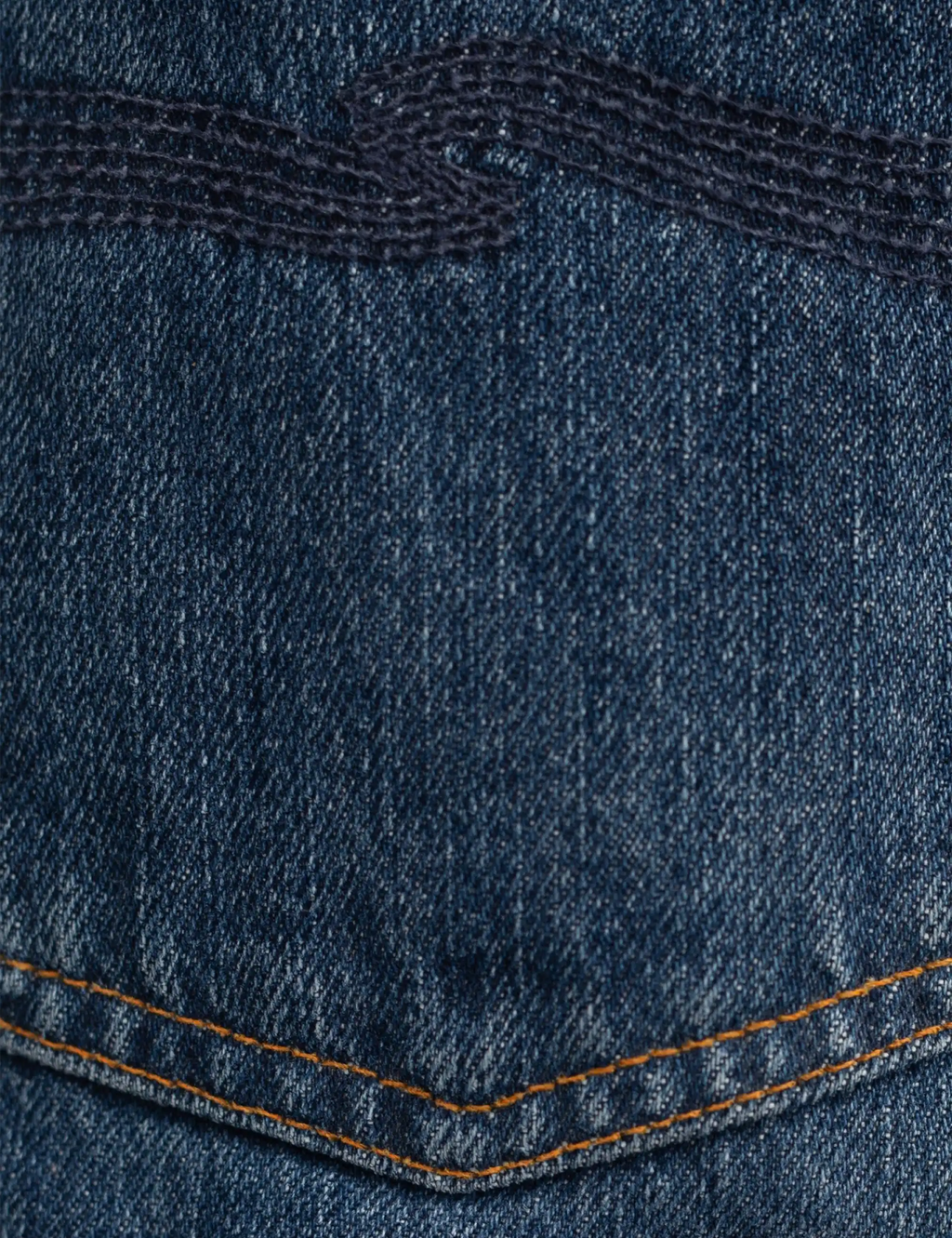 Blue denim jeans back yoke area with orange topstitching