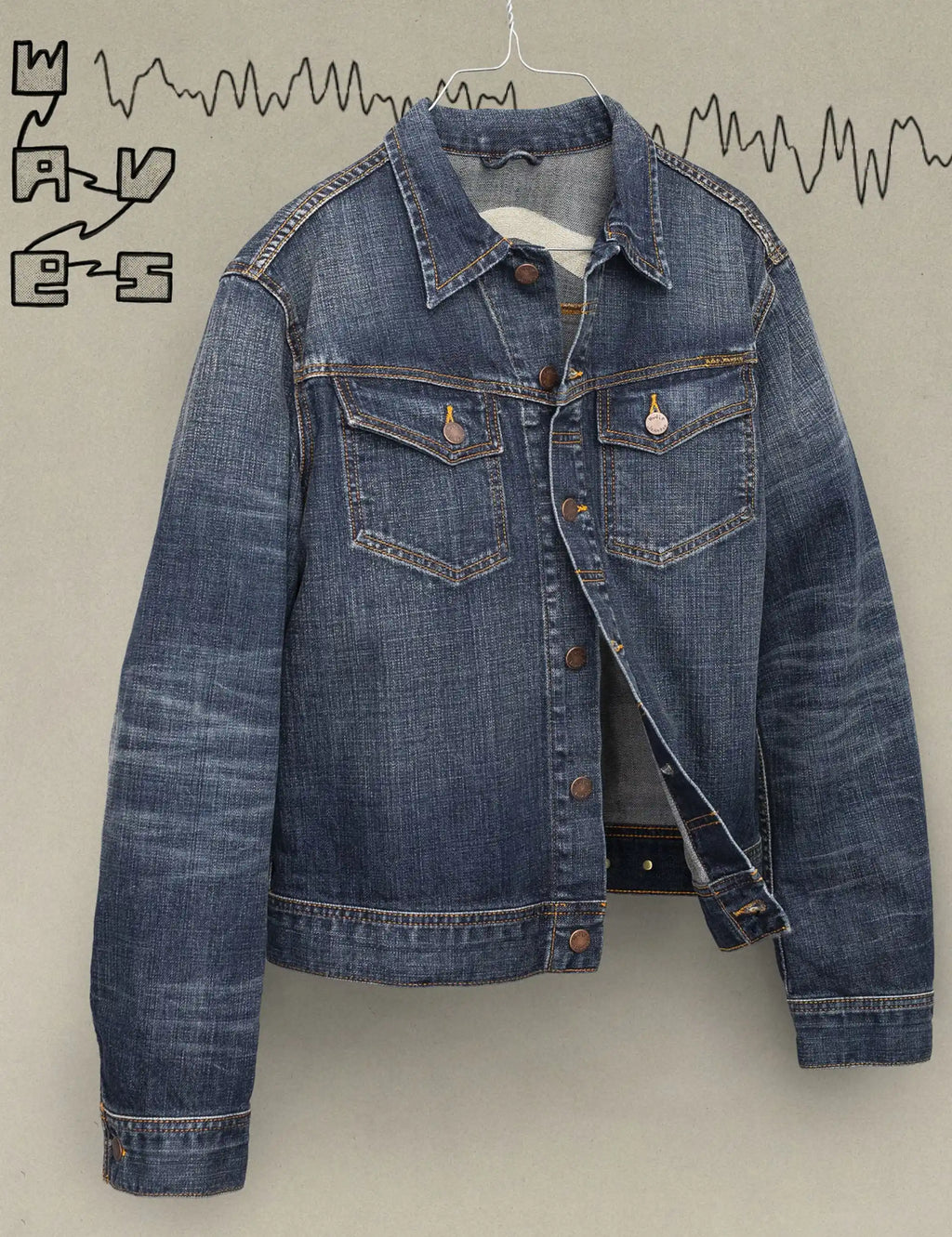 Dark blue denim jacket front with button placket, pointed collar, and chest flap pockets