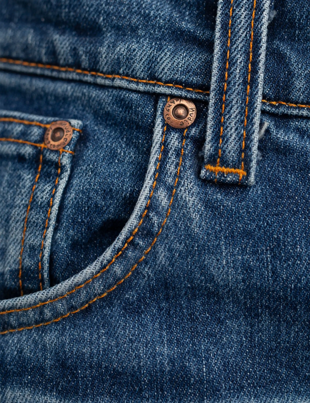 Blue denim jeans front with curved pocket opening and orange-contrast stitching