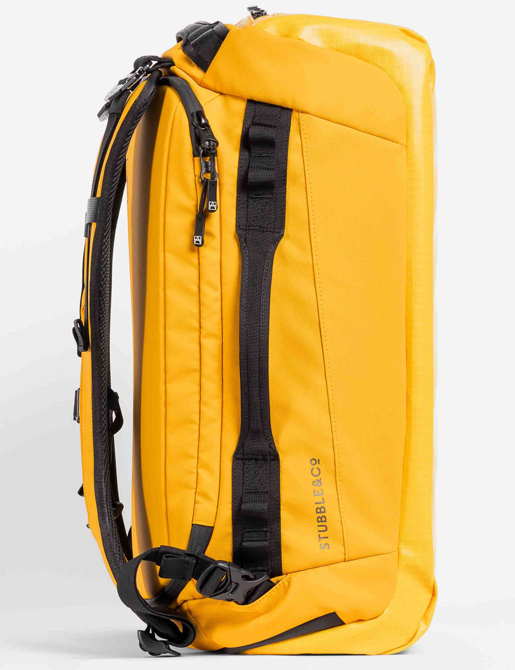 Yellow 30L kit bag side view with black webbing straps and zip pocket.