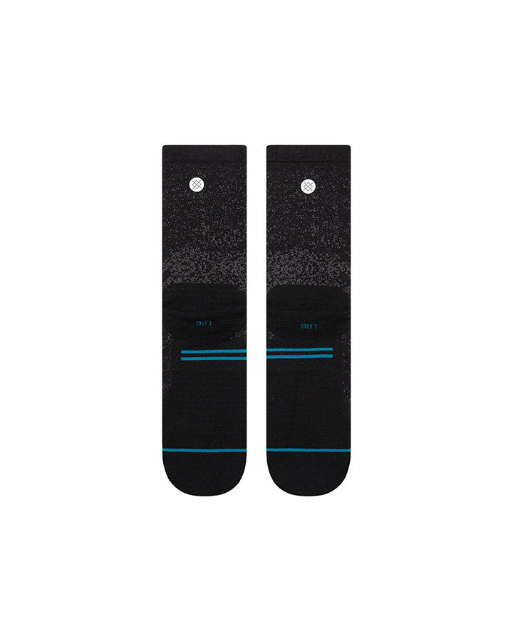 Black crew socks with speckled print and blue/red heel stripe accents
