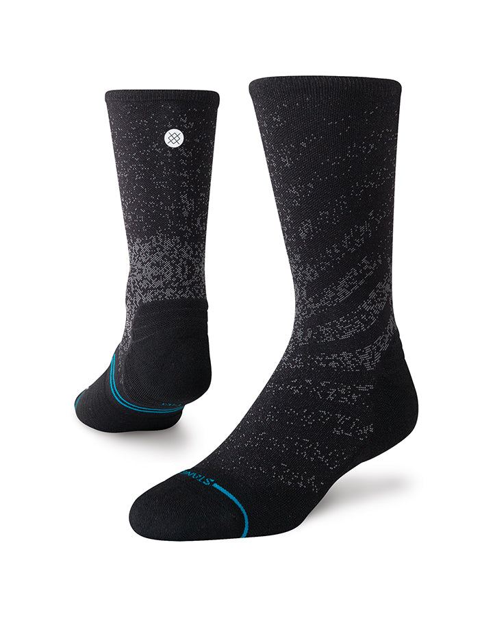 Black crew socks with speckled pattern and blue trim at toe and cuff