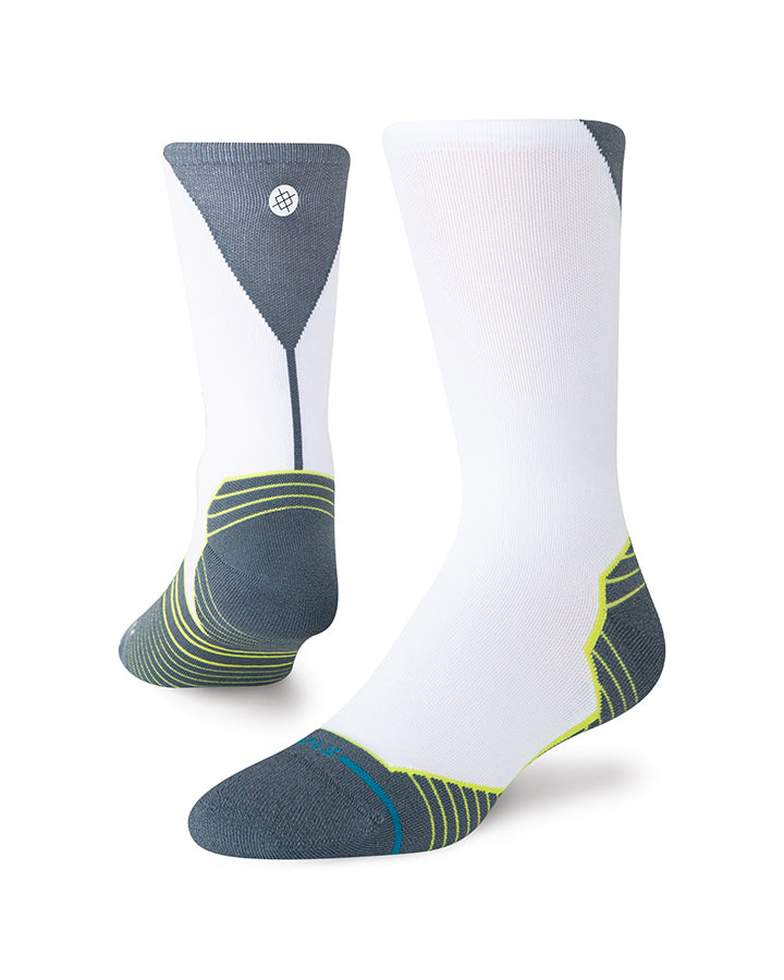 Crew socks with white body, dark toe/heel, neon yellow-green stripes and logo.