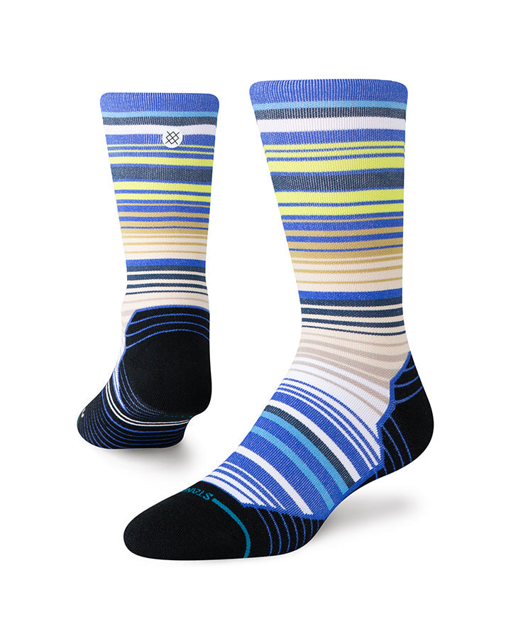 Light crew socks with blue, yellow, and multicolor stripes; black heel and toe