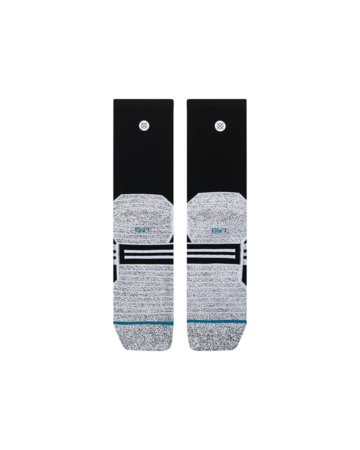 Black crew socks with small logo on cuff, gray heel-toe, and horizontal stripes