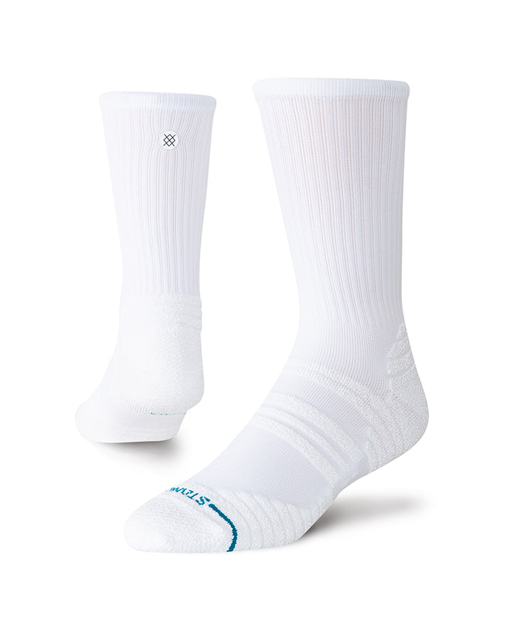 White crew socks, ribbed knit, small logo, blue heel/toe accents.