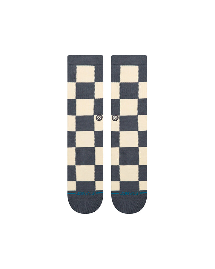 Pair of crew socks in navy with cream check pattern and small blue markers at toes
