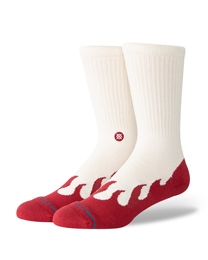 Crew socks with white upper, red toe and heel, flame graphic and logo on front