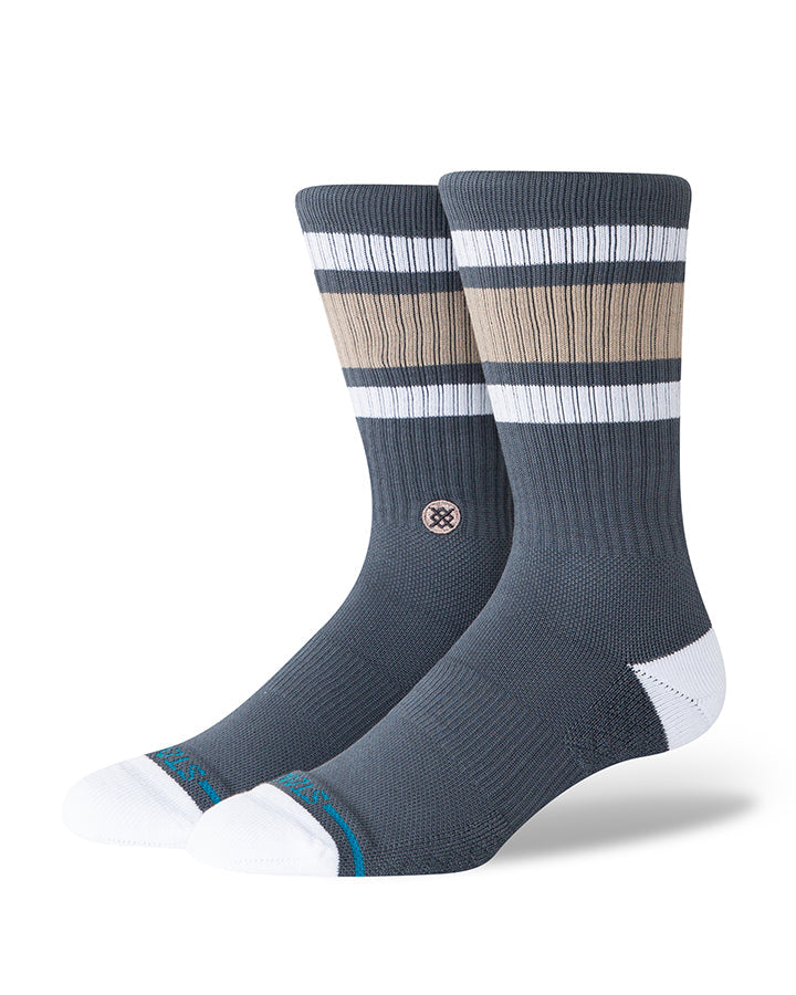 Navy crew socks with tan and white stripes, knit logo at ankle, cushioned white toe