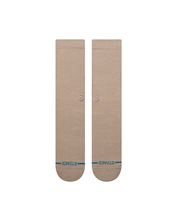 Pair of light gray crew socks with small circular emblem on calf and reinforced toe