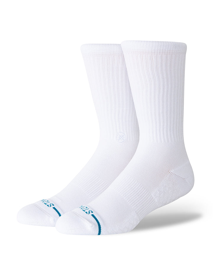 White crew socks with ribbed knit and small blue logo near toe