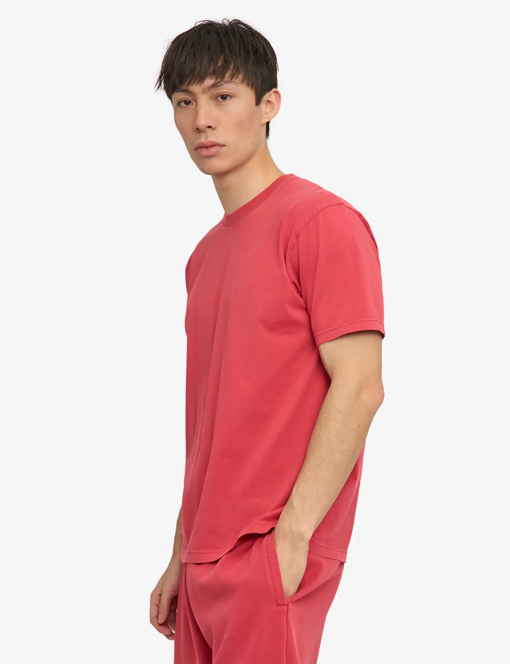 Faded red crew-neck t-shirt with short sleeves, side view
