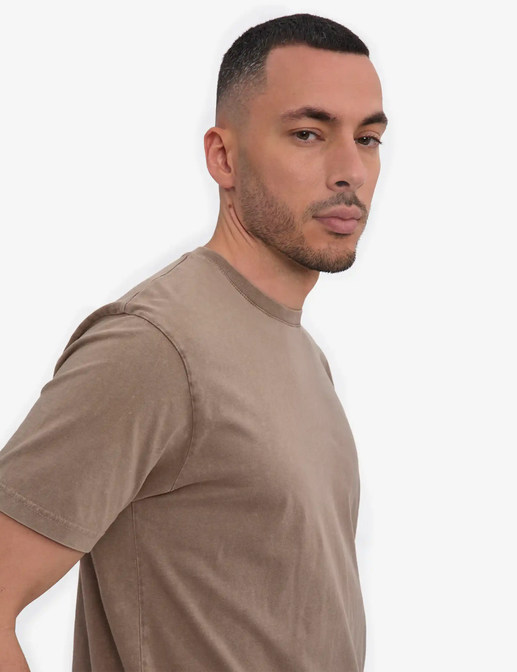 Faded khaki crew-neck organic t-shirt close-up on shoulder and sleeve