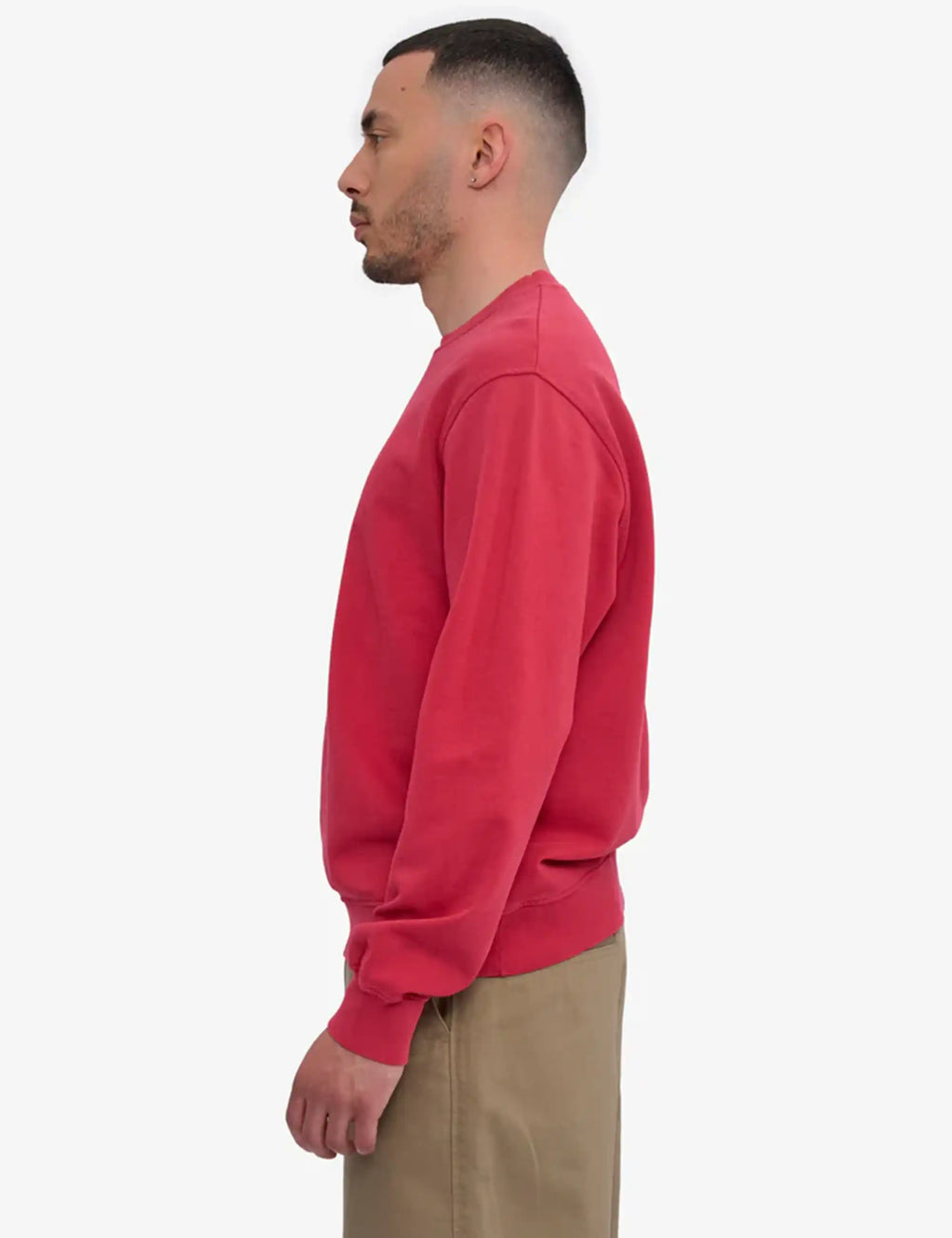Faded red sweatshirt side view with crew neckline and relaxed fit