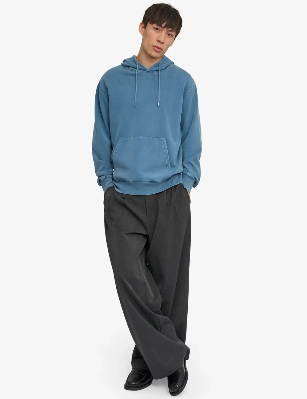 Faded indigo pullover hoodie with front kangaroo pocket and long sleeves.