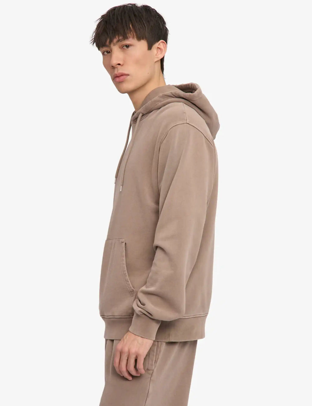 Faded khaki hoodie with hood and drawstring, side view with front pocket
