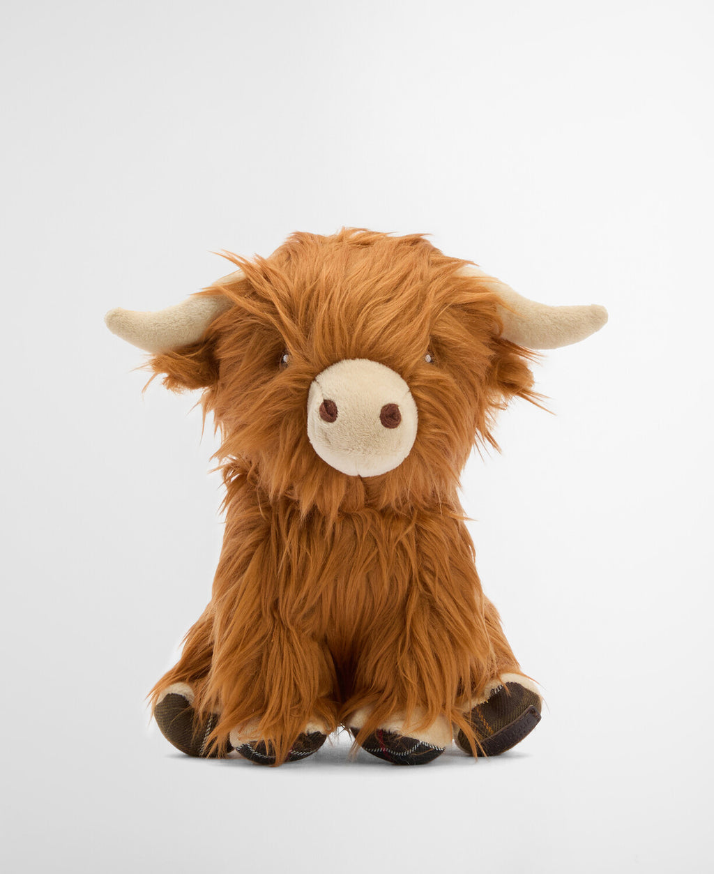 Brown plush Highland cow dog toy, seated front view with white face and tan muzzle