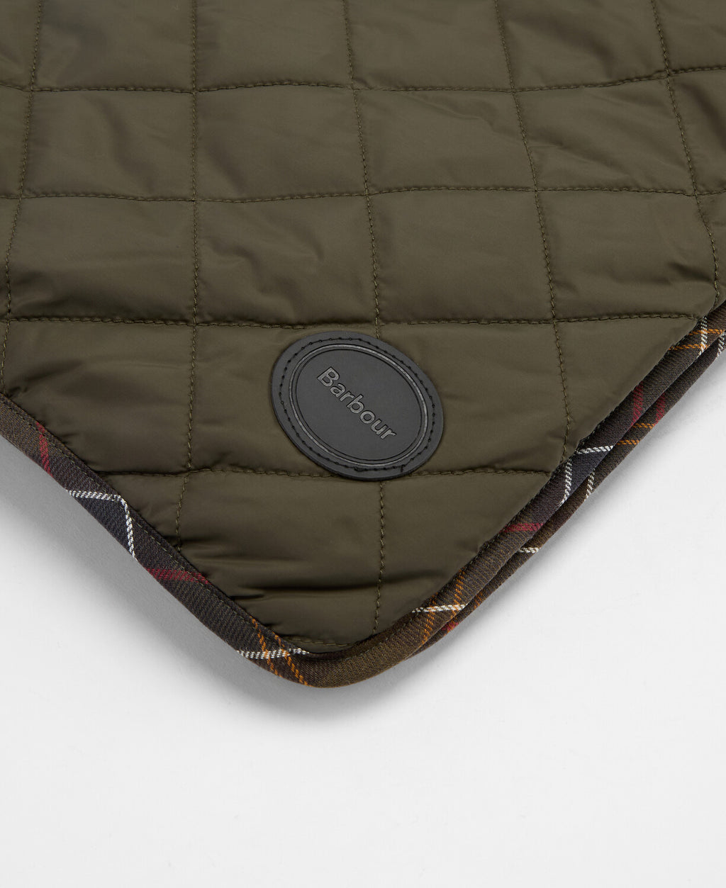 Dog quilt and fleece blanket: olive quilt with round logo patch on corner