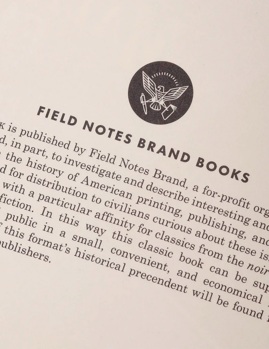 Off-white book page with circular “Field Notes Brand Books” logo and paragraphs.