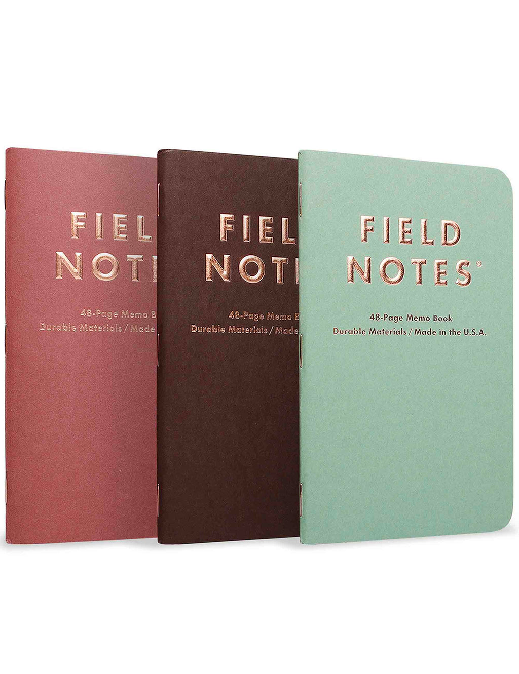 3-pack quarterly memo books with maroon, dark brown, and mint green covers