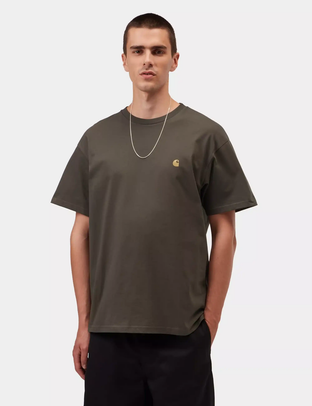 Dark brown t-shirt on model with small chest logo and crew neck