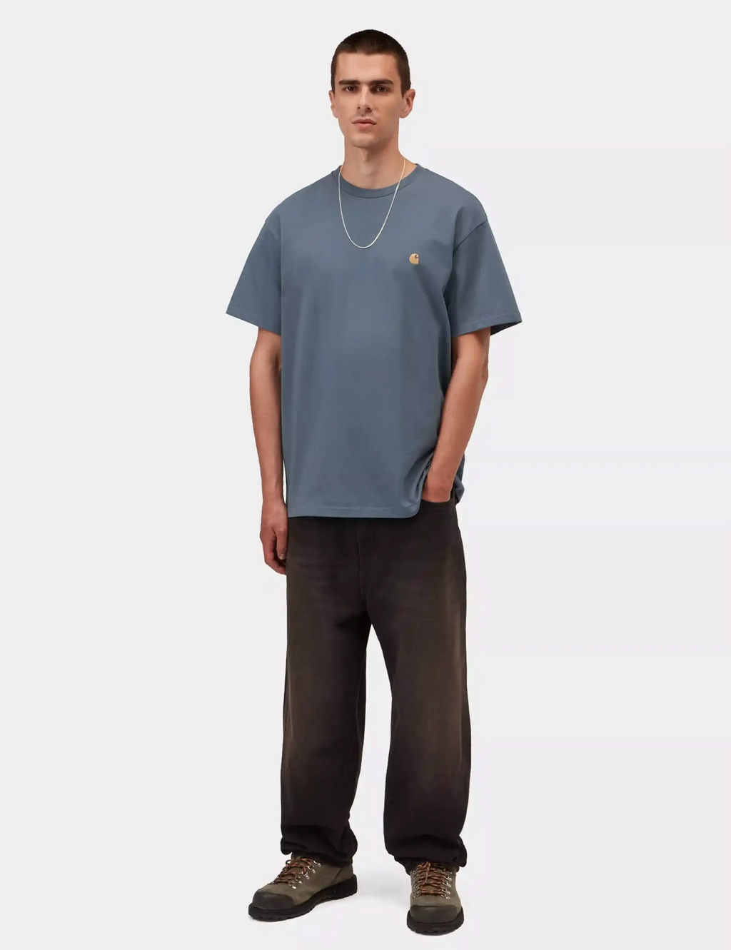 Men's blue crew-neck T-shirt with small gold chest logo and short sleeves