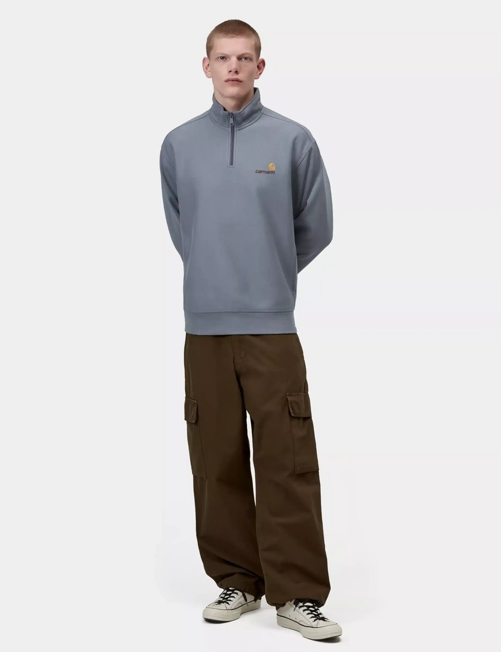 Shady blue half-zip sweatshirt with small chest logo and stand collar.
