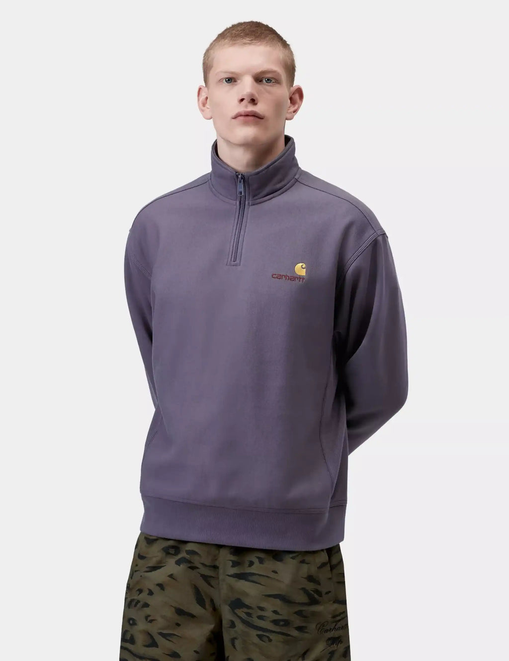 Men's purple half-zip sweatshirt with small yellow chest logo and front kangaroo pocket