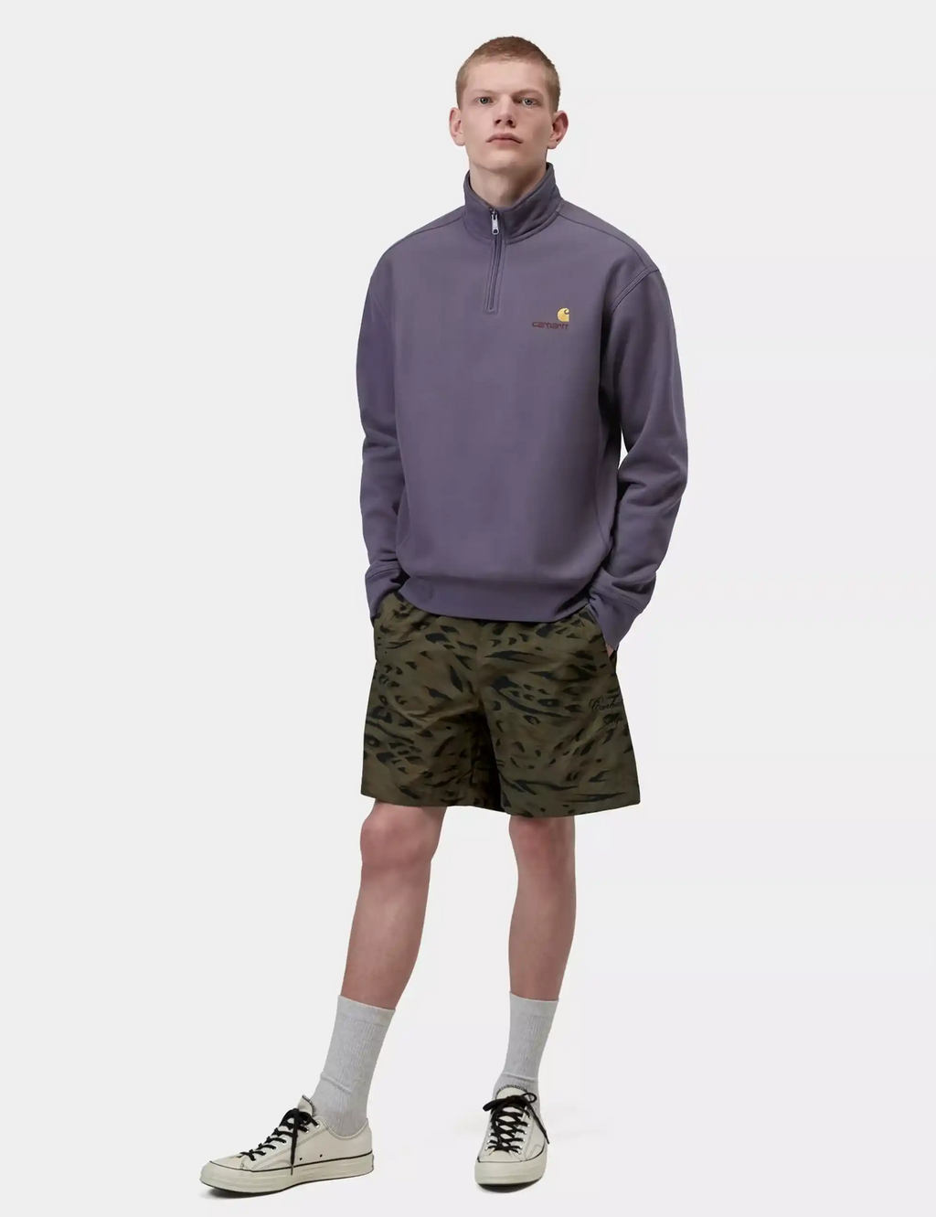 Men's purple half-zip sweatshirt with ribbed cuffs, collar, and front kangaroo pocket