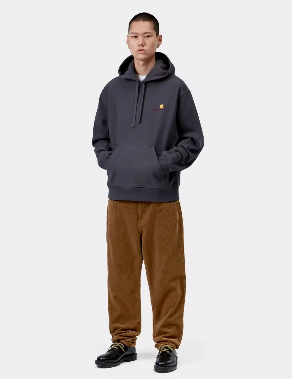Carhartt WIP Newel brown corduroy pants with relaxed fit and elastic cuffs