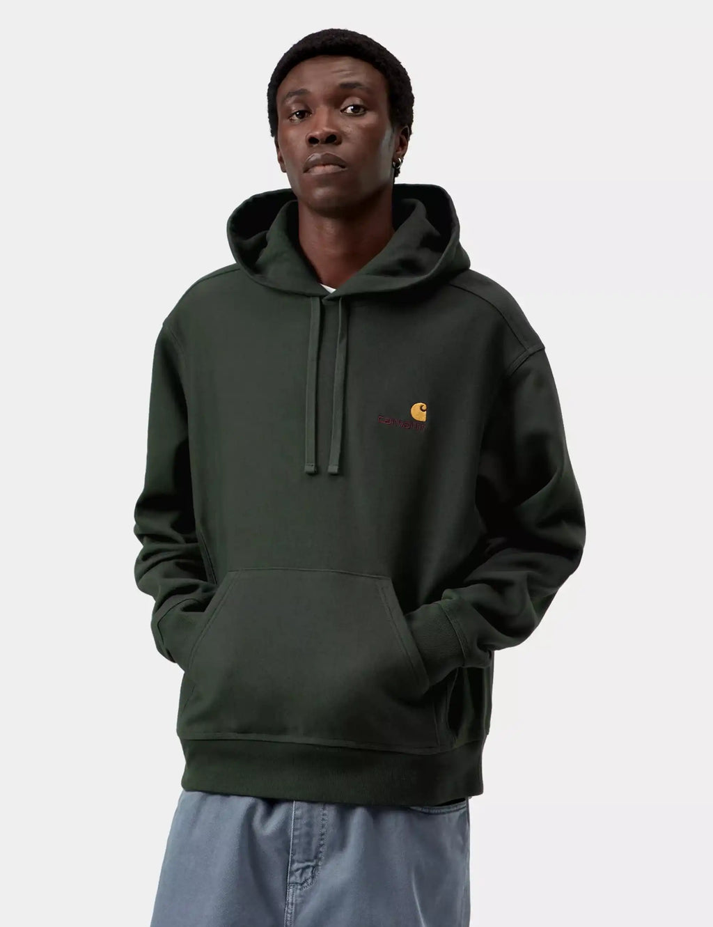 Dark green hooded sweatshirt on model, drawstring hood and kangaroo pocket, chest logo