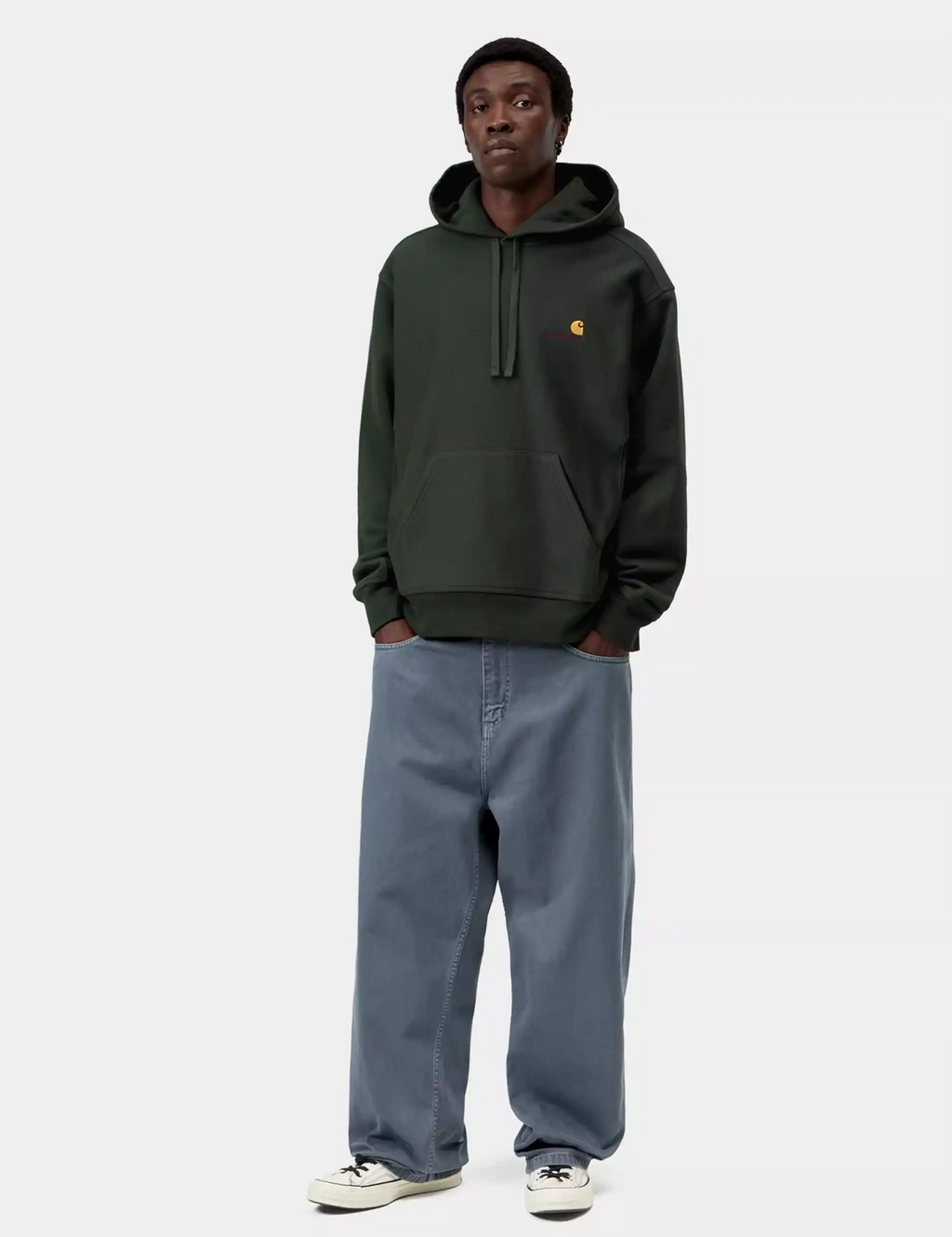 Dark green hooded sweatshirt with drawstring hood and chest logo, paired with blue jeans
