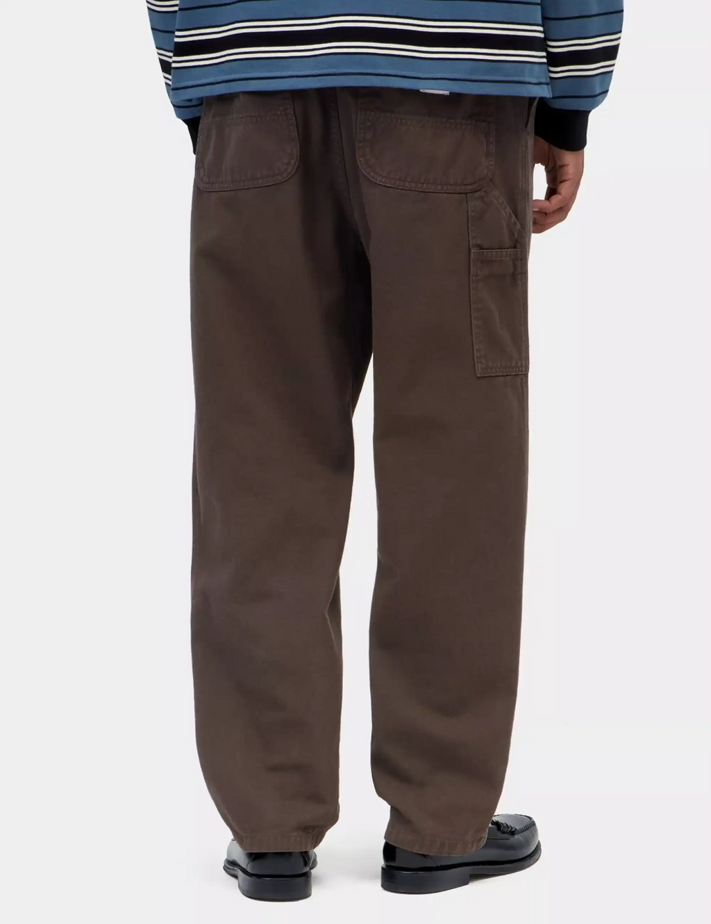 Brown loose-fit pants with back pockets and roomy straight leg opening