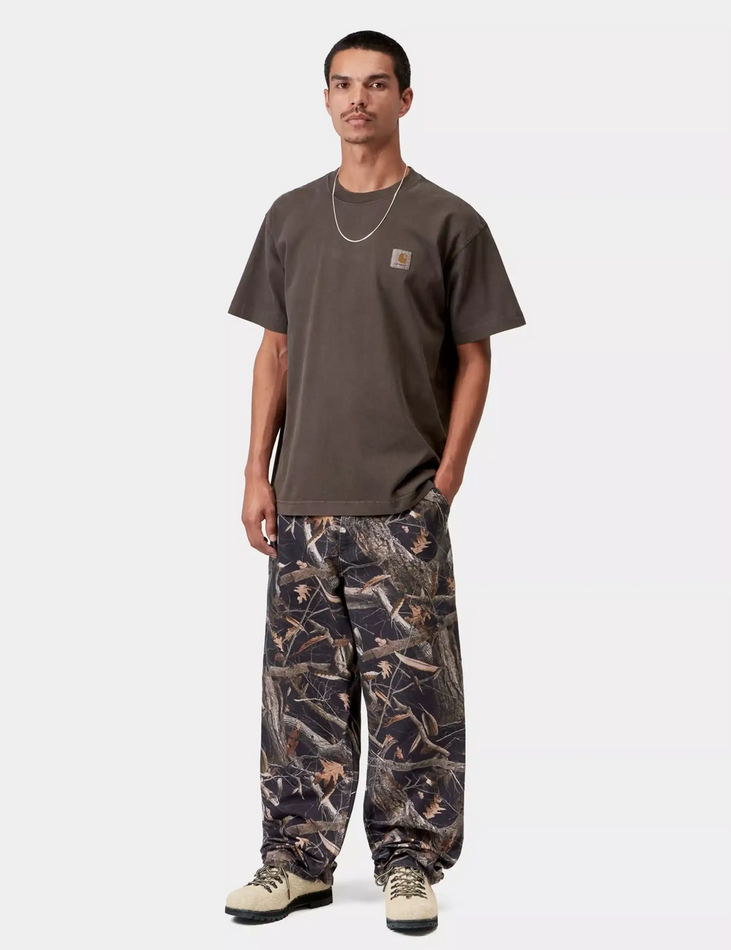 Dark tobacco brown Vista T-shirt worn by model with crew neck and chest logo patch