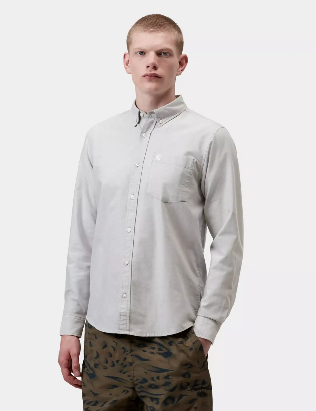 Carhartt WIP light gray button-up shirt with small chest logo and pointed collar
