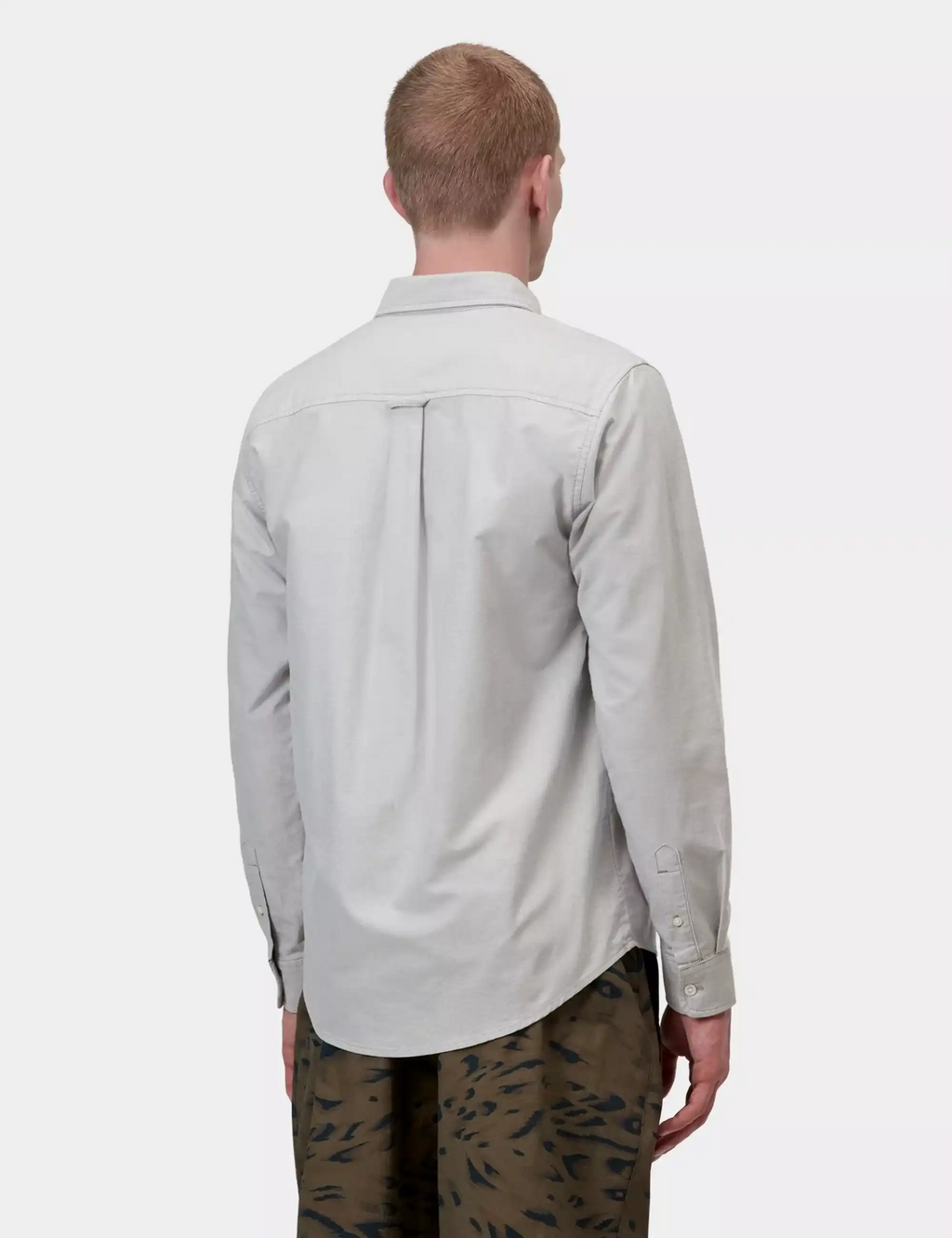 Carhartt WIP light gray button-up shirt, back view with yoke seam and long sleeves