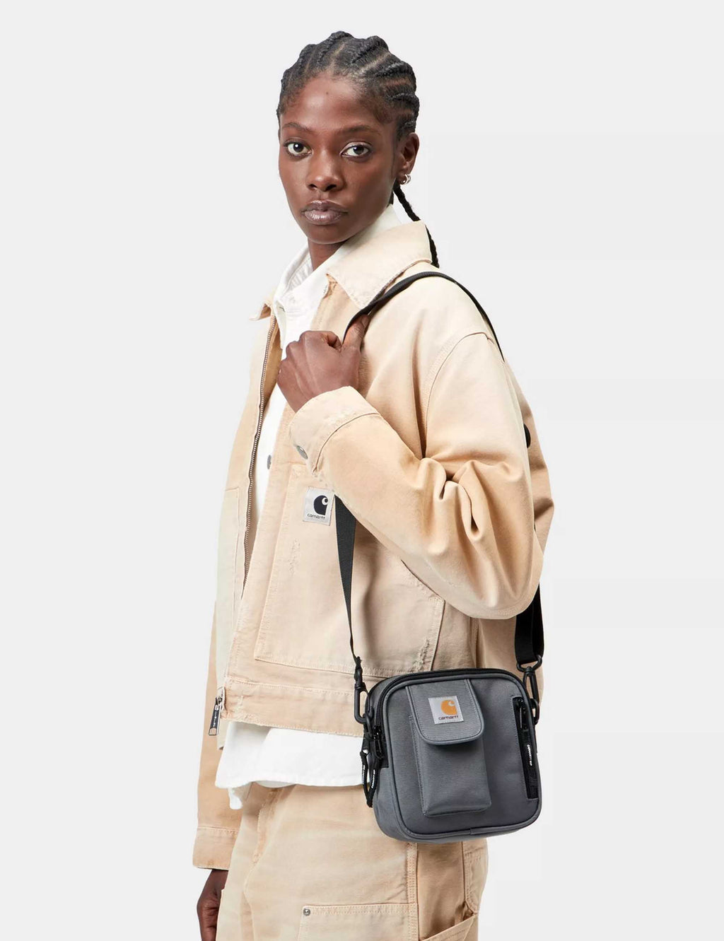 Small crossbody bag with front flap pocket and adjustable strap, dark