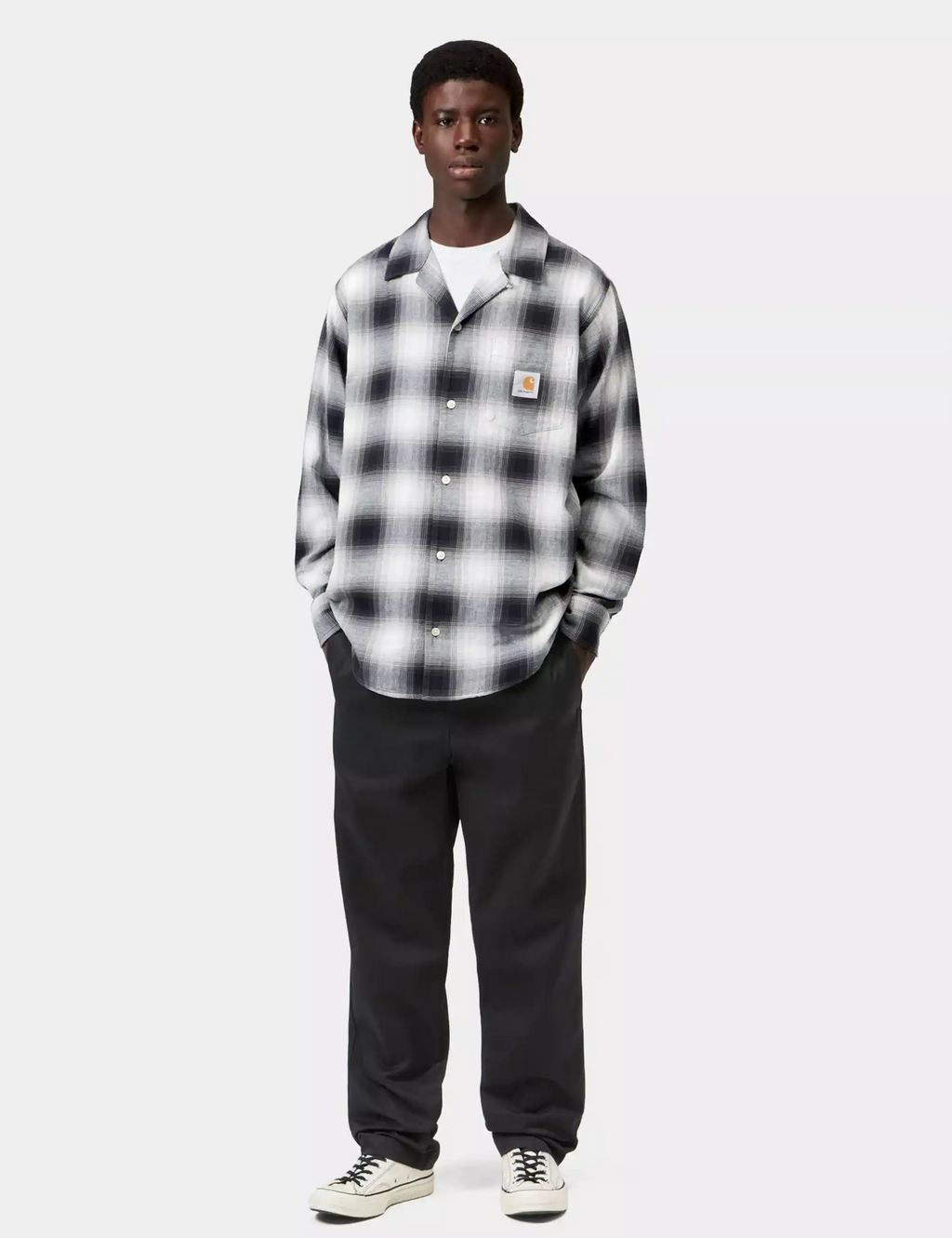 Black straight-leg trousers with belt loops and side pockets