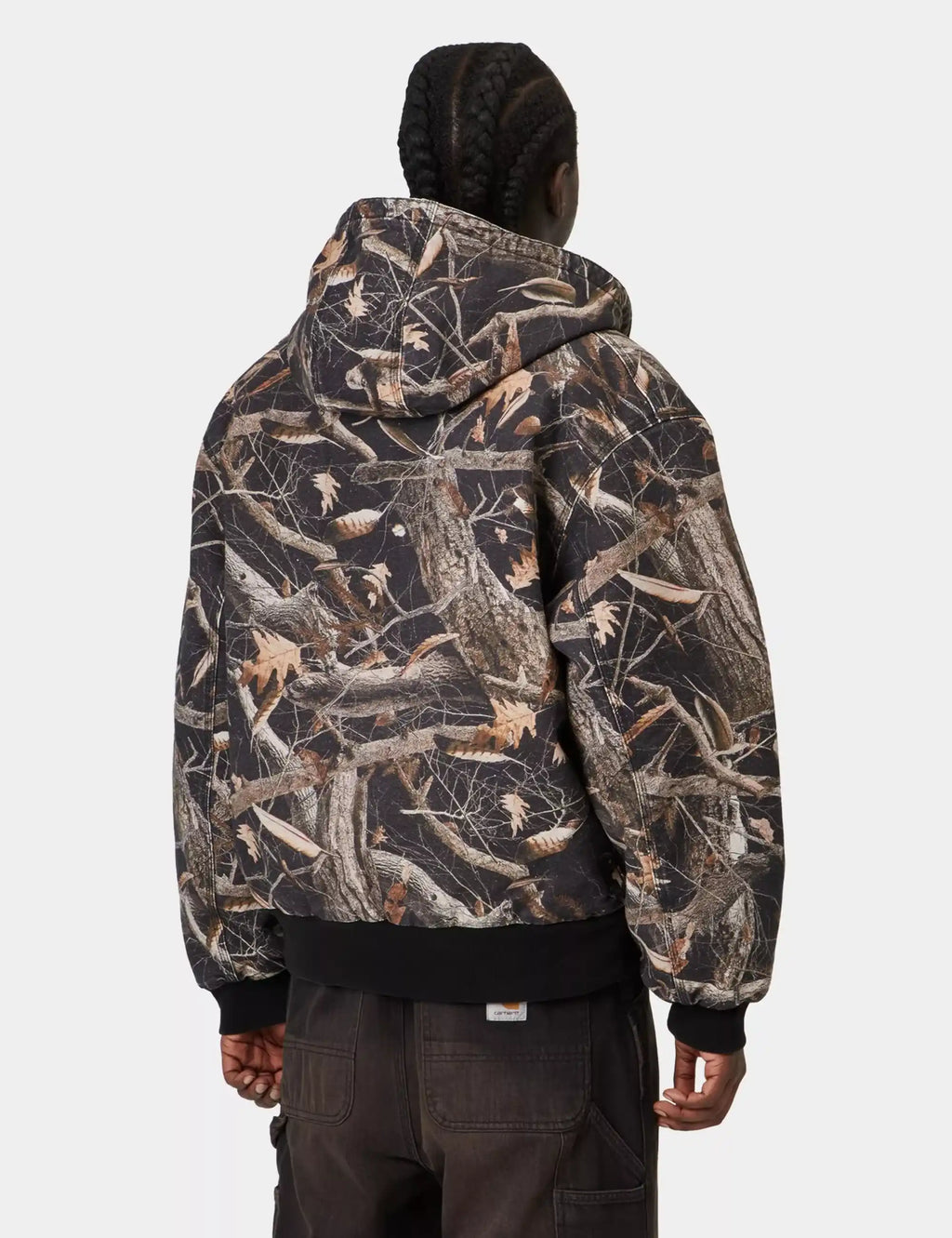 Carhartt WIP OG Active jacket back view in black feather-tree camouflage, hooded.