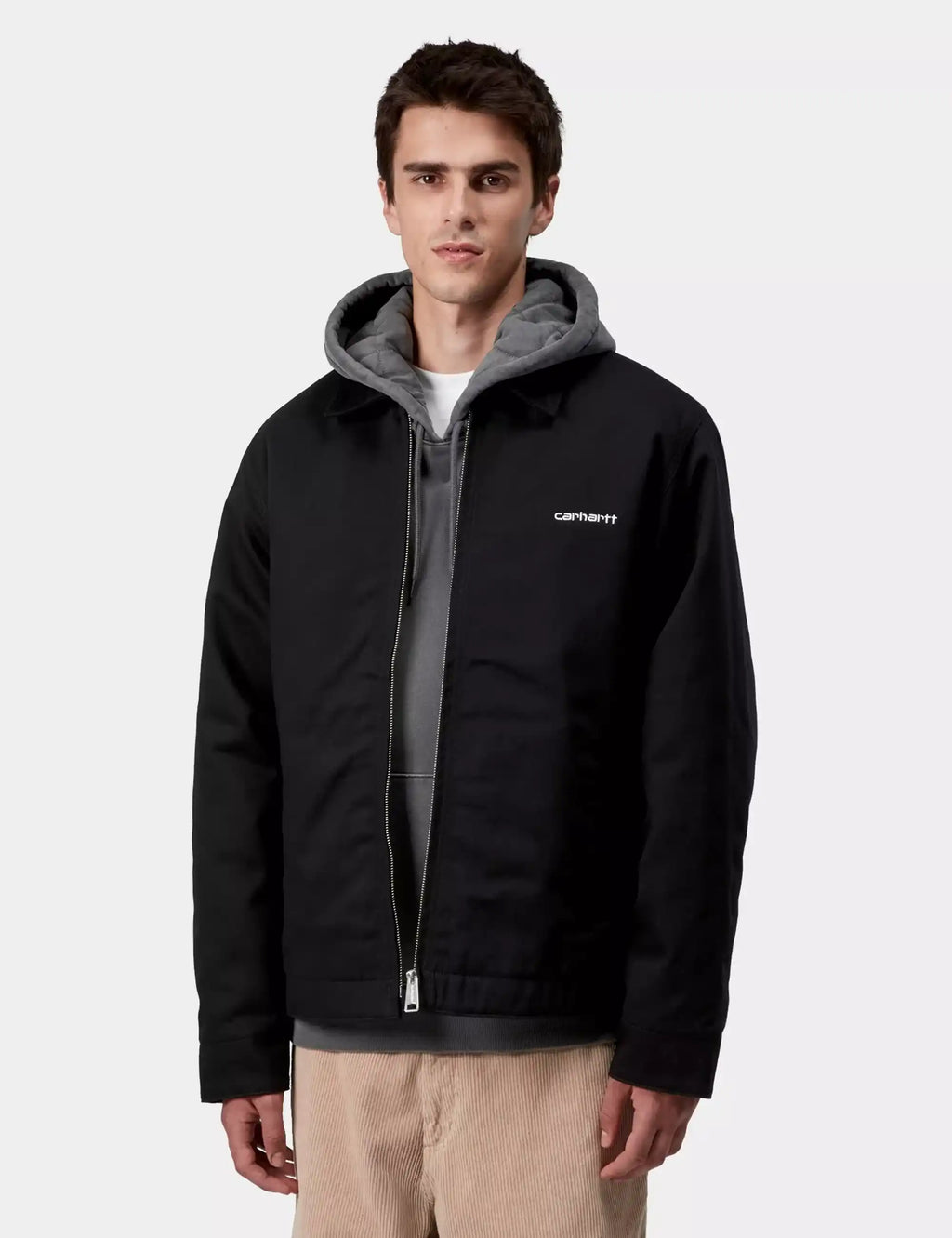 Black hooded jacket with zip front, gray hood lining, and carhartt chest logo